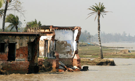 A damaged police station as a result of rising sea levels and coastal erosion 