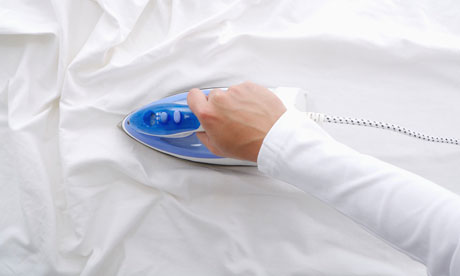 Leo Blog : A hand holding an iron, ironing on cloth