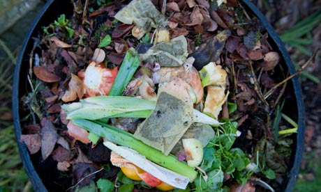 Tea bags in household kitchen and garden waste mixed in a domestic compost bin