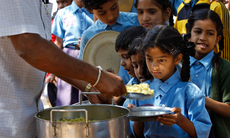 MDG : Jonathan Glennie  on Aid and poverty : A girl looks at food served to her for free 