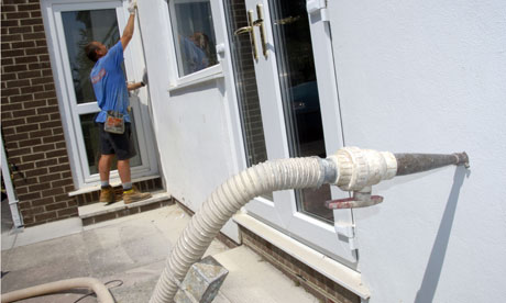 Green deal on insulation : Installing cavity wall insulation in modern house in Devon England
