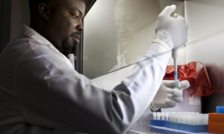 MDG : Scientist and doctors in Africa : A lab technican with pathogen samples in Cameroon