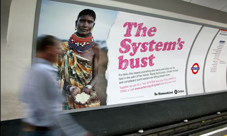 MDG : role of NGOs in development and poverty reduction : Oxfam advert in underground