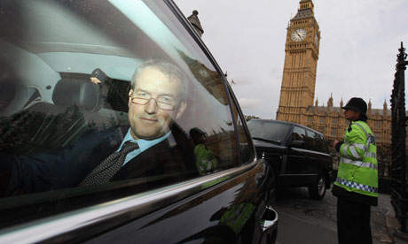 Owen Paterson, Secretary of State for Northern Ireland, leaves the Houses of Parliament