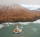 Sheel oil Arctic drilling rig Kulluk aground on the southeast shore of Sitkalidak Island