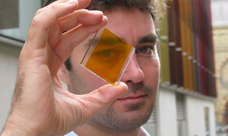 Dr. Henry Snaith from Oxford photovoltaics holding glass with printed solar cell