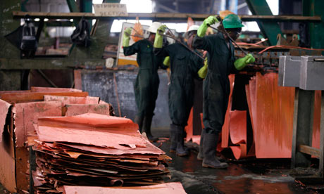 MDG : Zambia : Workers peel copper sheeting from plates, Mufulira mine in the Copperbelt region