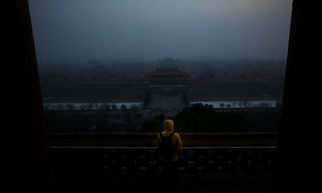 Air Pollution Attacks Beijing Again : A tourist looks at the Forbidden City as PM25 covers