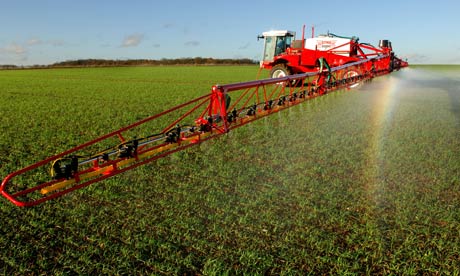 Monbiot on Neonicotinoids : Farmer spraying insecticide in agricultural field of  Bedfordshire