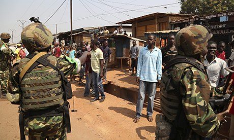AU Burundi soldiers calm an angry mob at Gobongo district in Bangui