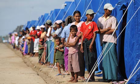 People displaced by Cyclone Nargis line up by their tents for a visit from UN secretary-general Ban Ki-Moon in 2008 in Kyondah, Myanmar. Photograph: Stan Honda / AFP / Getty Images