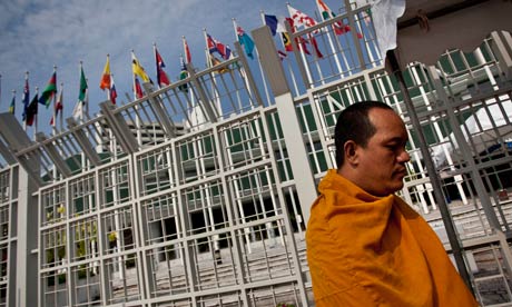 A Buddhist monk offers prayers at the UN climate talks in Bangkok