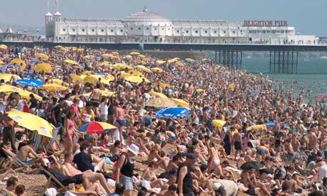 Crowded beach by the East Pier in Brighton