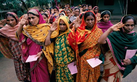 women repay microloans in Bangladesh