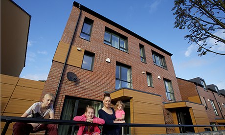 Justine Hutton and her children at their passive house in Oldham