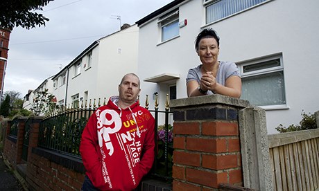 Alison Isaacs and her husband Darryl-Paul outside their home in Oldham