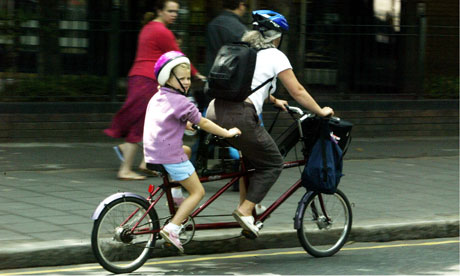 A family cycling on a tandem bike