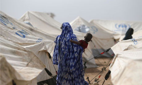 A Malian women carries a child