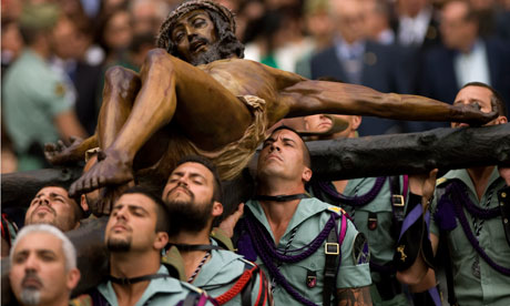 Members of the Spanish Legion in Malaga carry a statue of Christ during a holy week procession.