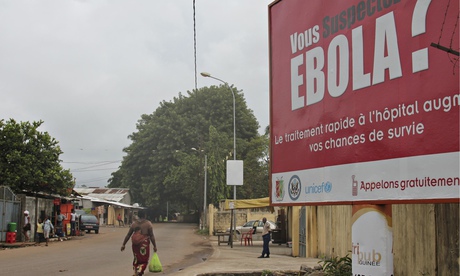 A billboard with a message about Ebola is seen on a street in Conakry, Guinea