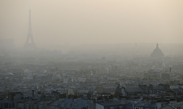 Air pollution in Paris : Eiffel tower through a haze of pollution in Paris 