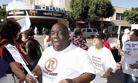 Demonstrators representing disability groups protest outside the cinema hosting the premiere of Tropic Thunder