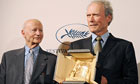 Cannes film festival president Gilles Jacob hands Clint Eastwood his lifetime achievement Palme d'Or