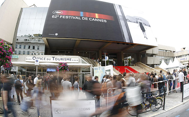 Cannes film festival: Film fans and journalists queue in front of the Palais in Cannes