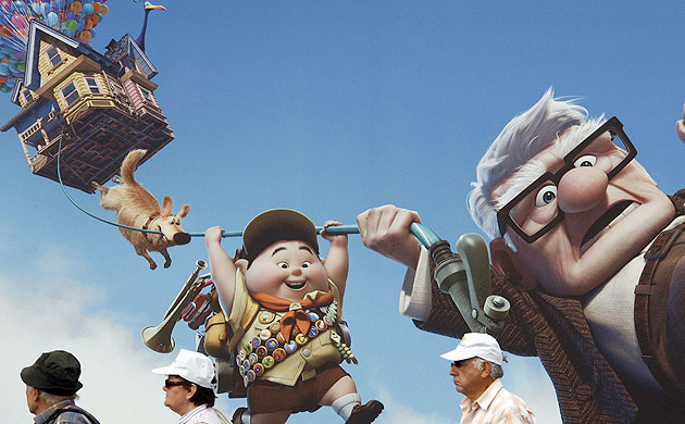 Cannes film festival: People walk past a giant advertising board for Pixar's Up in Cannes
