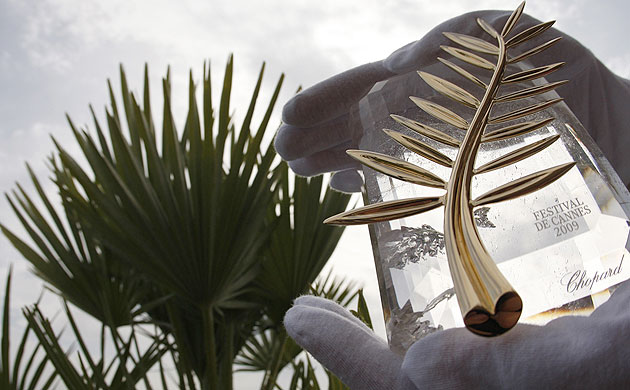Cannes film festival: A Chopard representative holds the Palme d'Or in Cannes