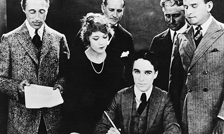 Charlie Chaplin signs the contract to establish United Artists on 17 April