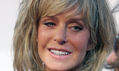 Farrah Fawcett poses for photographers on the red carpet before Comedy 