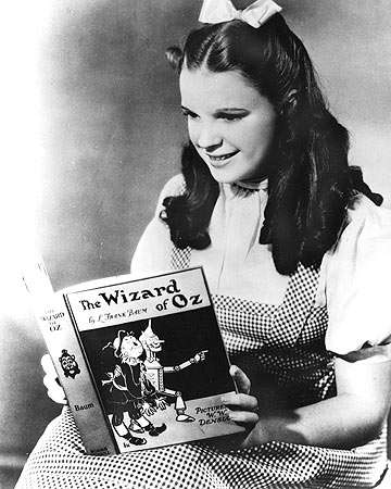 Judy Garland as Dorothy with the book of The Wizard of Oz