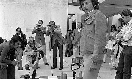 Roman Polanski in front of a giant chessboard in Munich in 1972