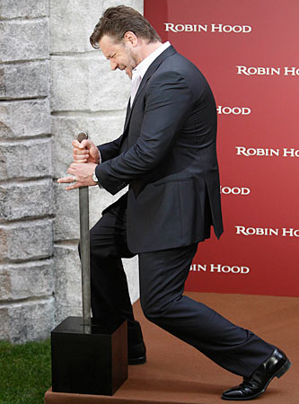 Russell Crowe poses with a sword at a Robin Hood photocall in Madrid