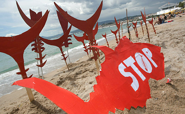 Cannes film festival day6: Greenpeace protest on beach at Cannes film festival