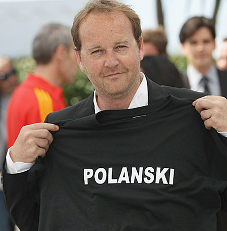 Cannes 2010 day 7: Director Xavier Beauvois with a T-shirt supporting Roman Polanski at Cannes