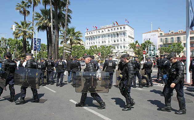 Cannes festival day 10: French police stand guard during Hors la Loi protest in Cannes