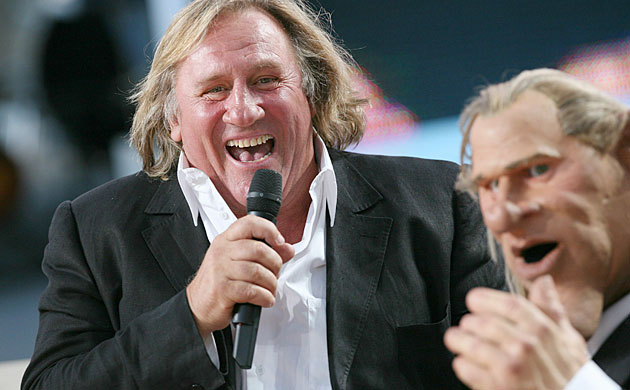 Cannes festival day 10: French actor Gerard Depardieu laughs next to his puppet in Cannes