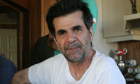 Iranian director Jafar Panahi sits at his home after being released from prison