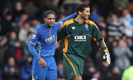 Portsmouth's Glen Johnson celebrates with David James