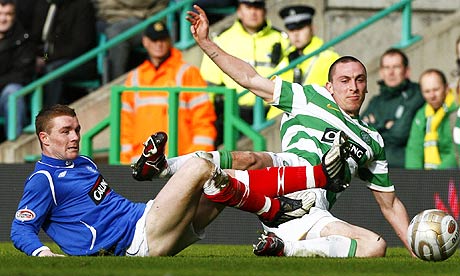 Rangers' Flek tussles with Celtic's Brown during Scottish Premier League soccer match in Glasgow