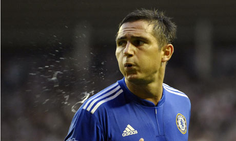 Frank Lampard spits on the pitch while playing for Chelsea against 