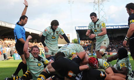 Northampton's Dylan Hartley, left, celebrates as Courtney Lawes scores a try against London Wasps.