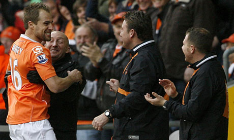Luke Varney celebrates his wonder-striker with manager Ian Holloway and the Blackpool staff