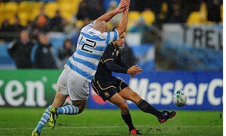 Felipe Contepomi of Argentina closes in on Scotland's Dan Parks