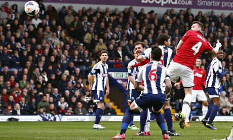 Manchester United's Phil Jones, right, scores at West Bromwich Albion in the Premier League