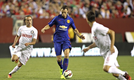 Manchester United's Jonny Evans, centre, has been part of Louis van Gaal's three centre-back system