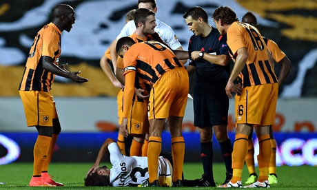 Hull City's Yannick Sagbo, left, shows his dismay after he is sent off against Lokeren