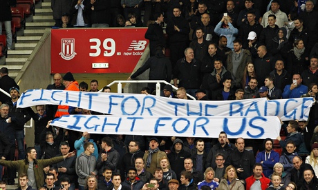 The Chelsea supporters send a message to the players from the stands during the match at Stoke City